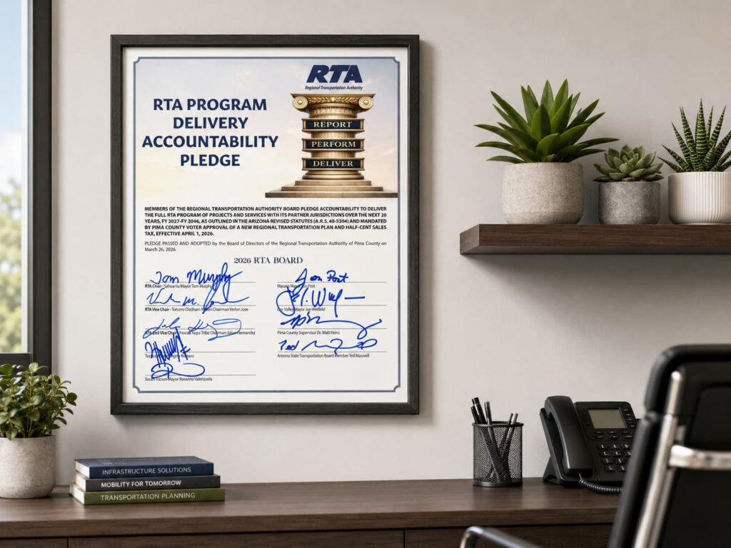 An RTA Accountability pledge signed by the 2026 RTA Board of Directors hangs on an office wall.